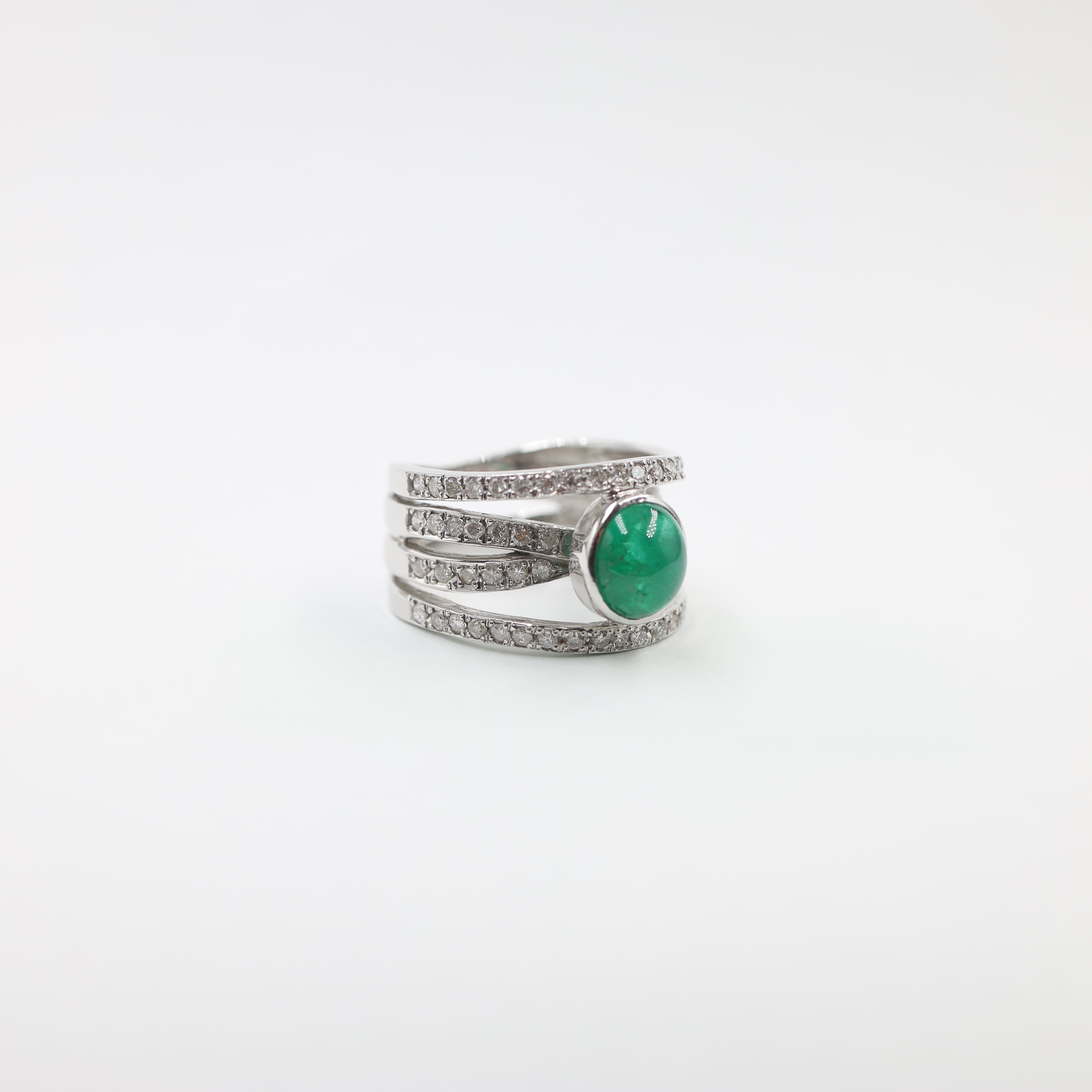 Platinum ring with emerald center piece
