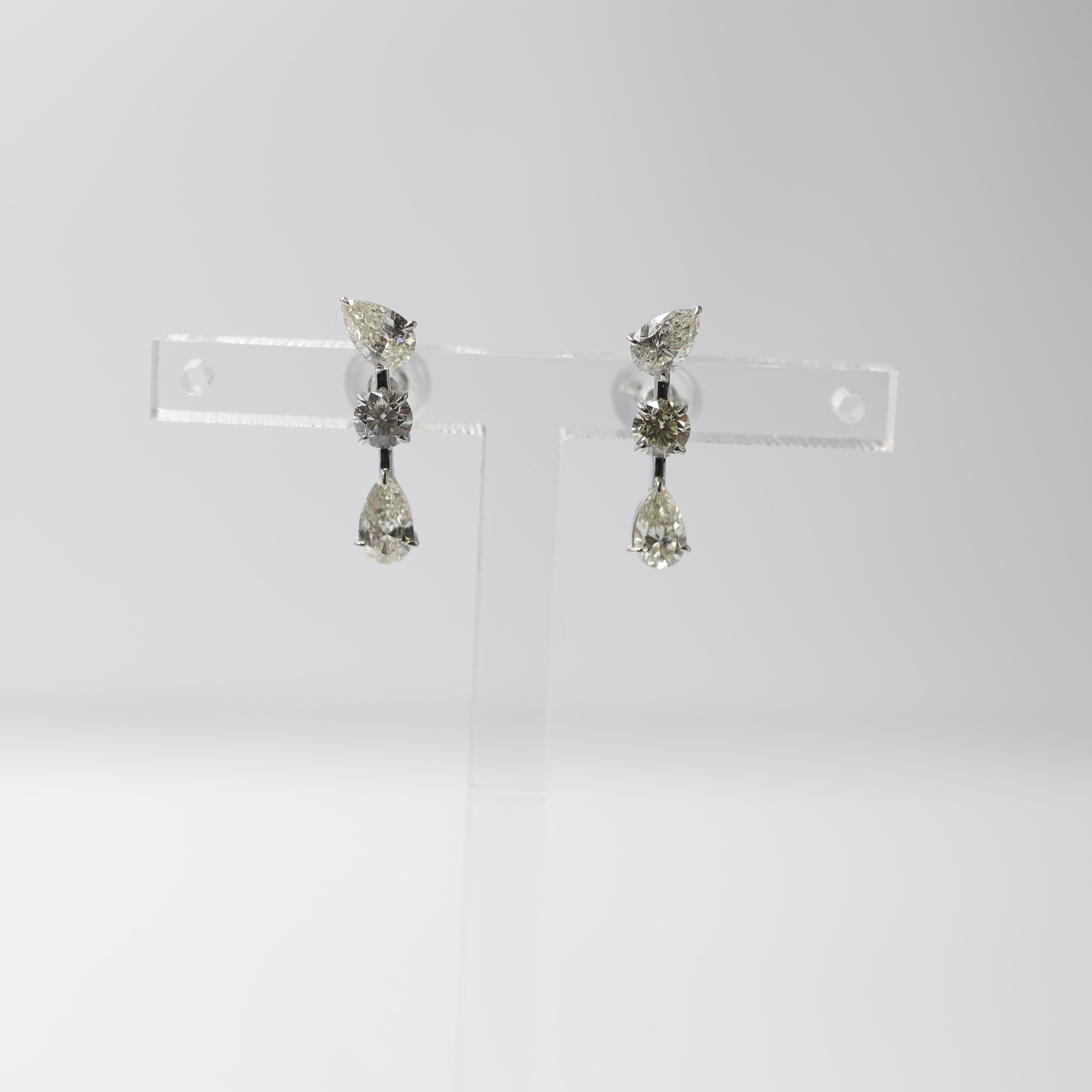 Elegant Platinum Three-Stone Diamond Drop Earrings (1.14 ctw)