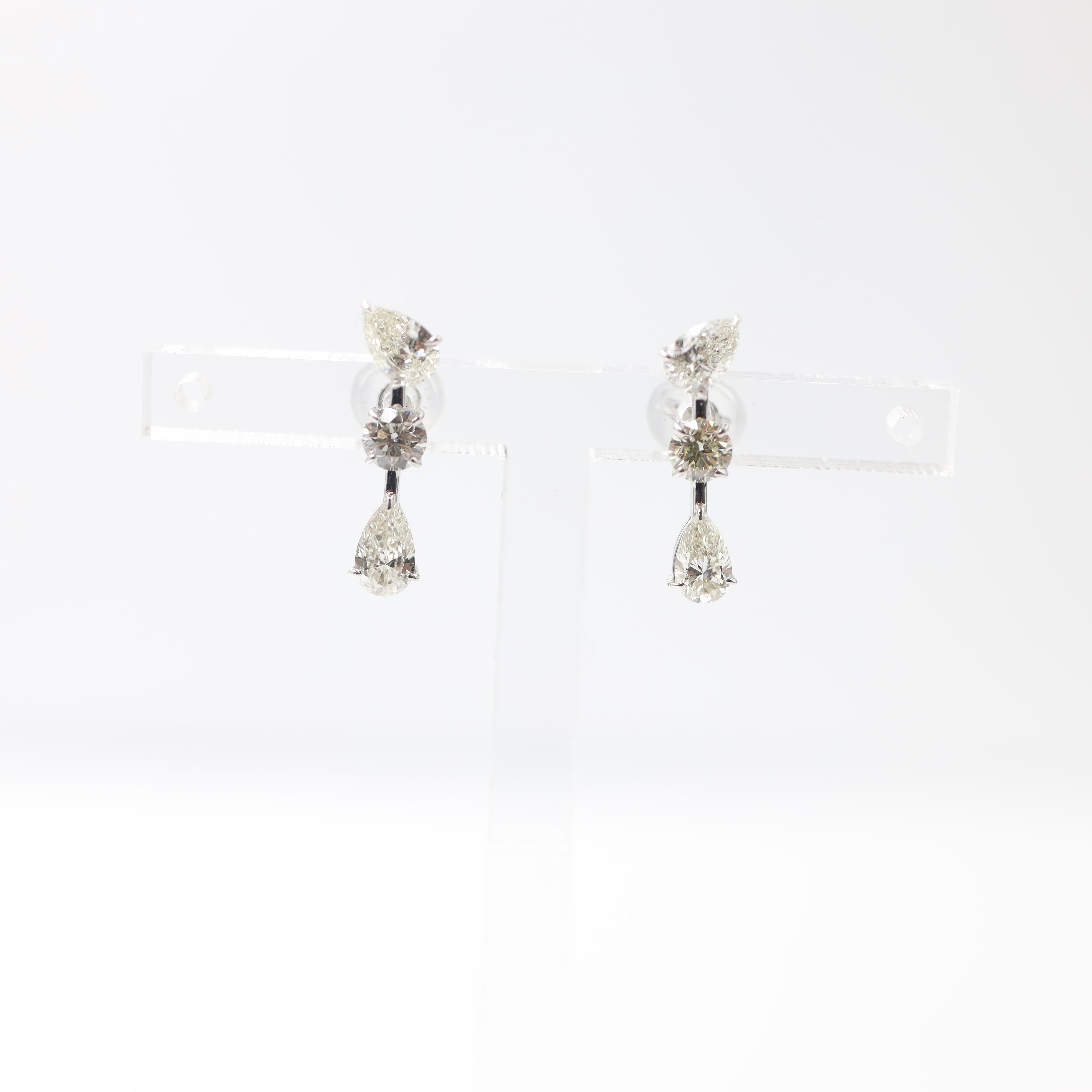 Elegant Platinum Three-Stone Diamond Drop Earrings (1.14 ctw)