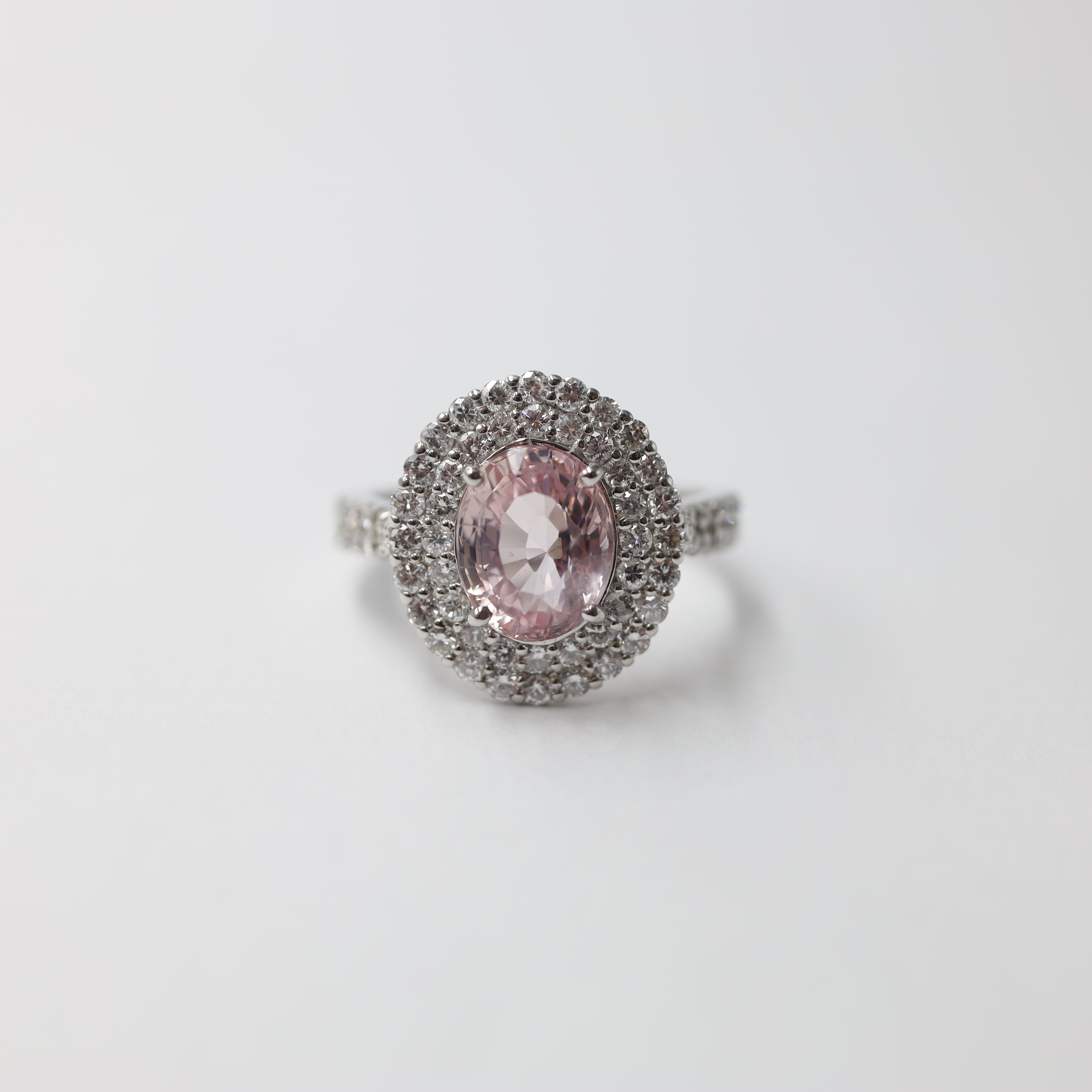 Platinum Padparadscha Sapphire and Diamond Halo Ring