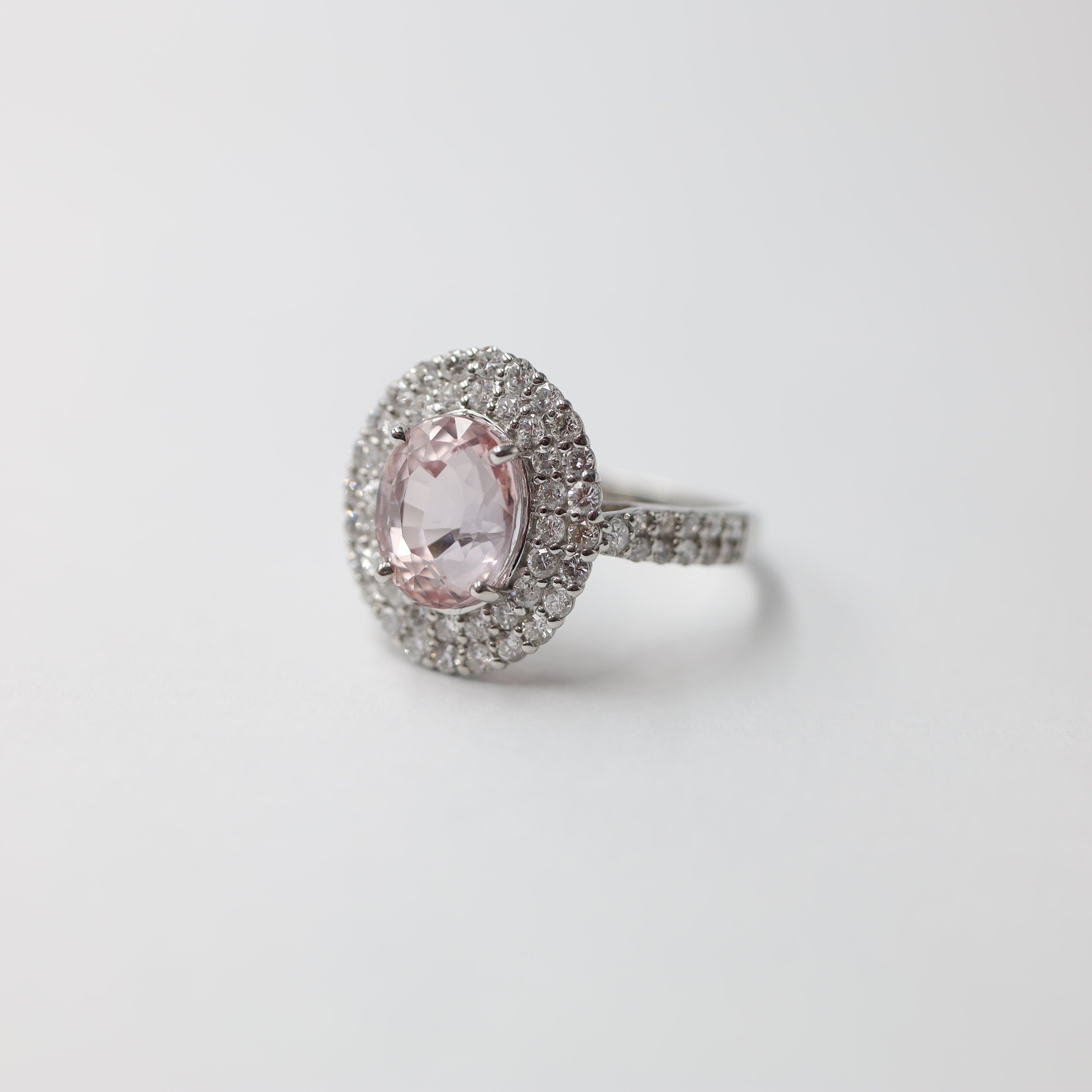 Platinum Padparadscha Sapphire and Diamond Halo Ring