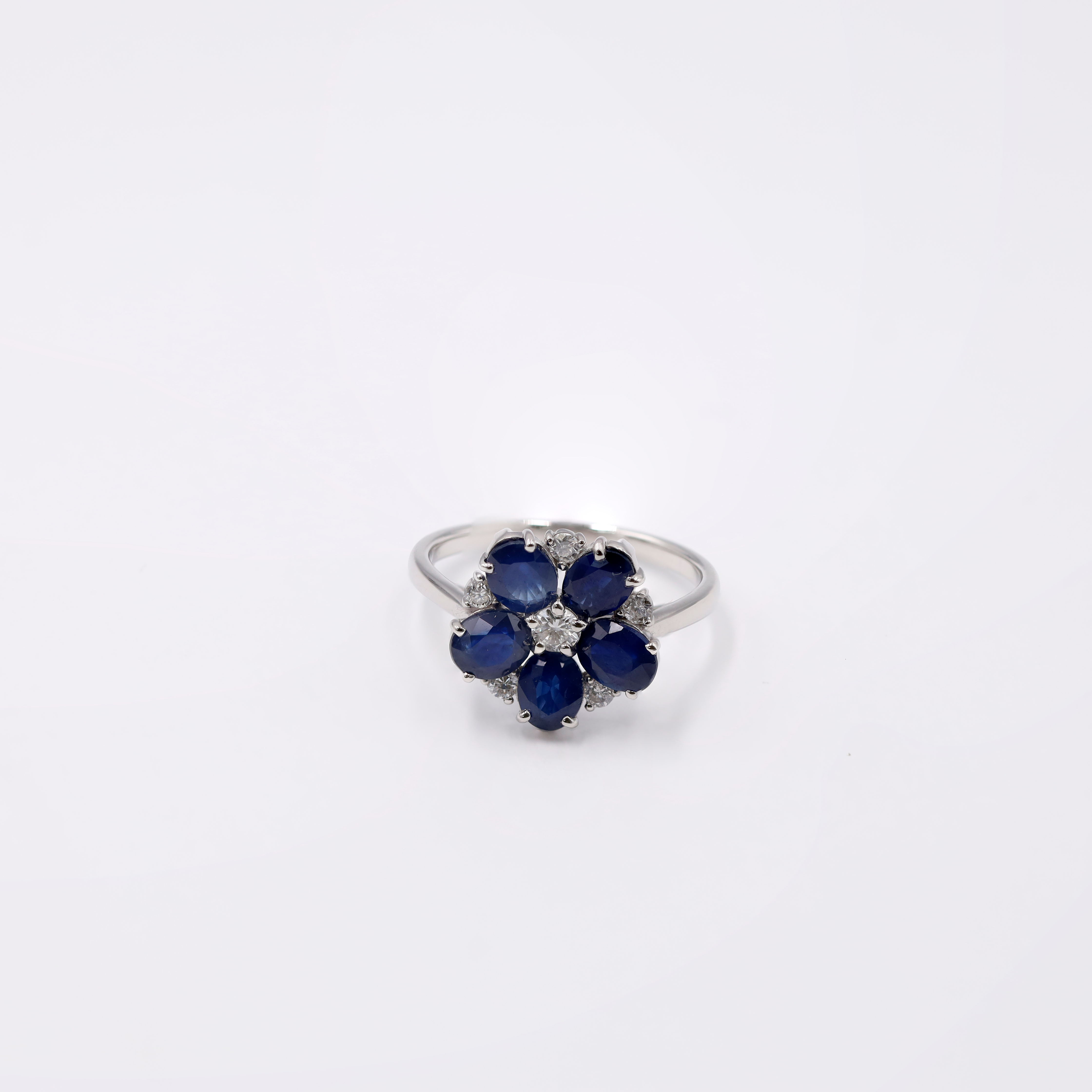 Platinum ring showcasing a substantial 2.27 carat blue Sapphire center stone flanked by sparkling accent diamonds (totaling 0.49 ct), all weighing a total of 4.00 grams