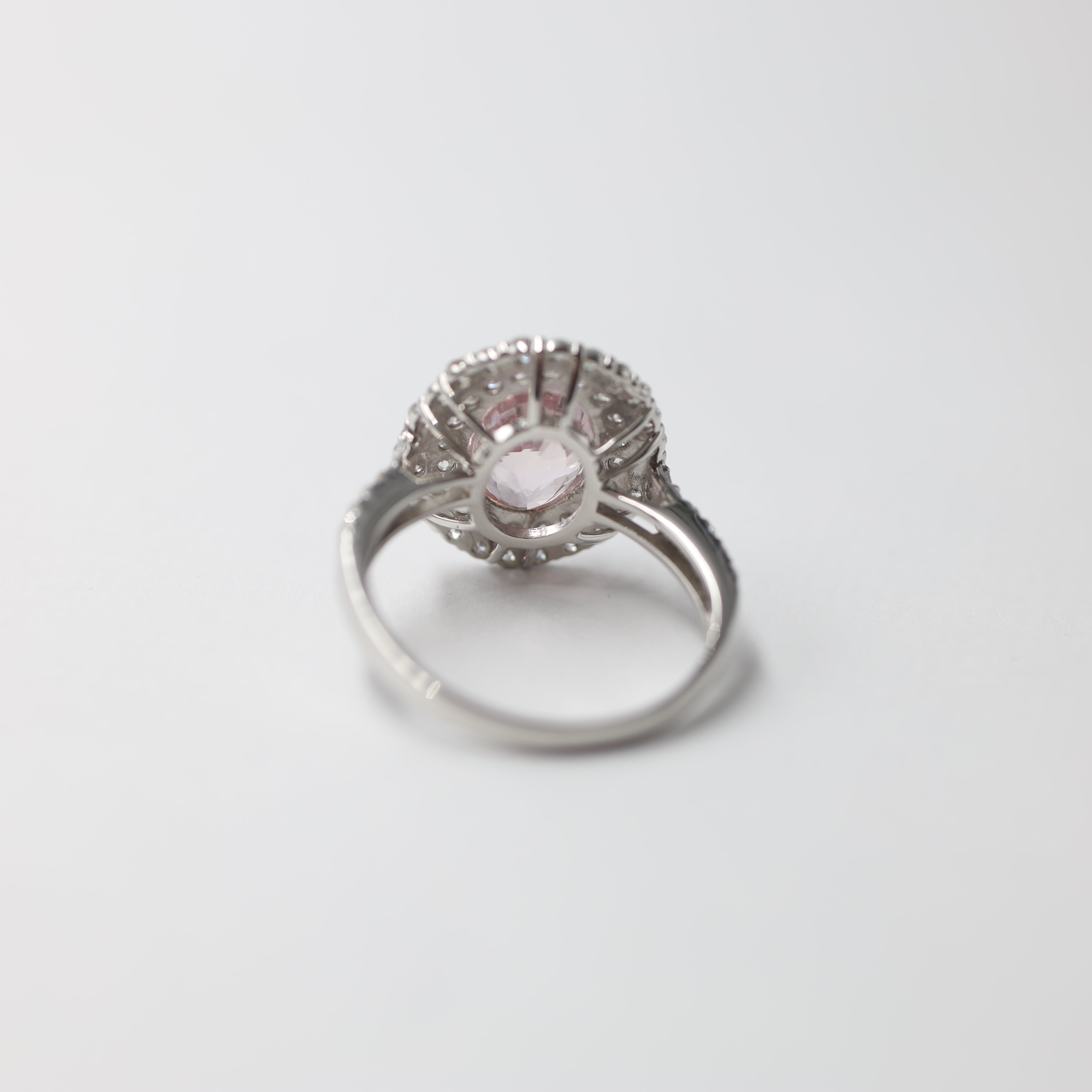 Platinum Padparadscha Sapphire and Diamond Halo Ring