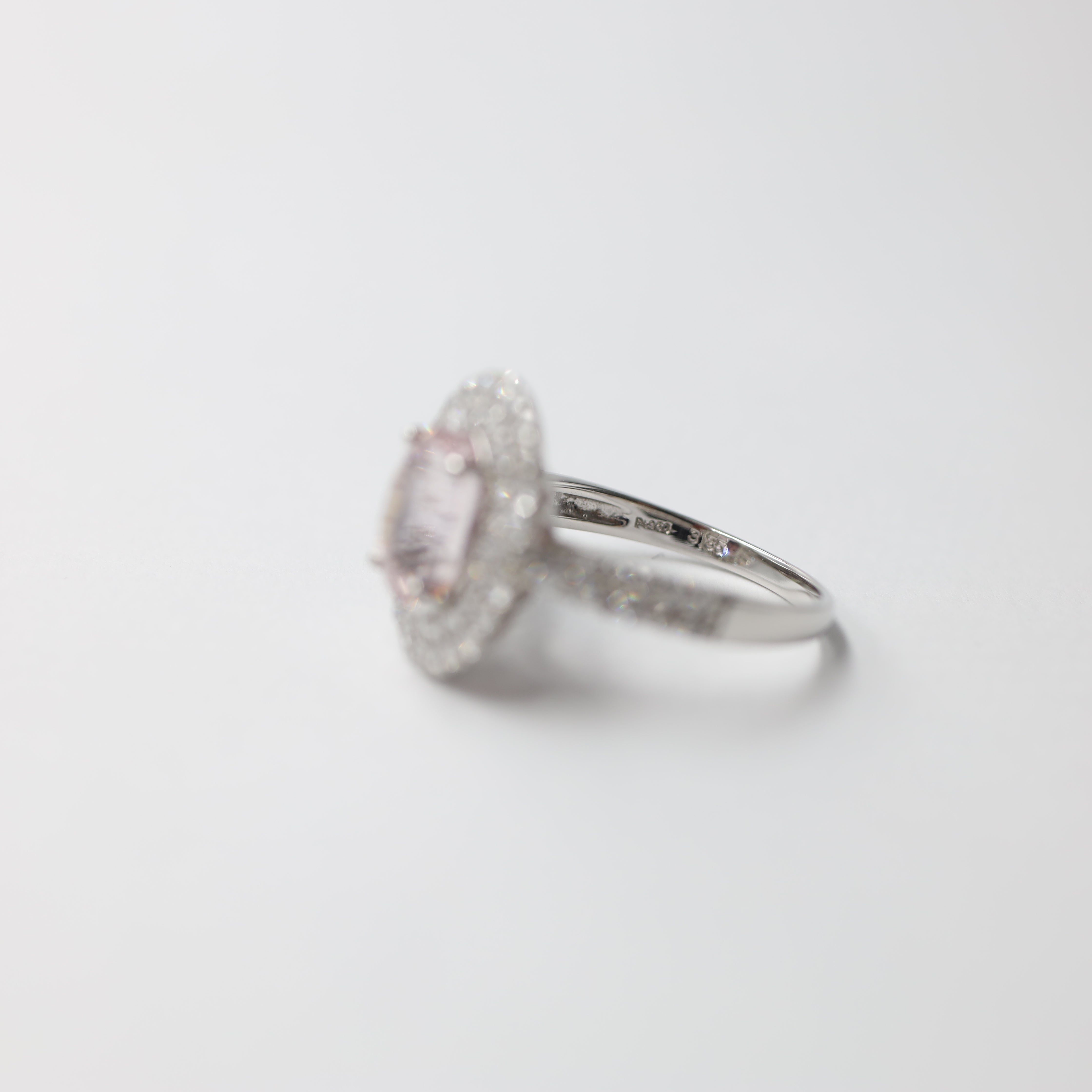 Platinum Padparadscha Sapphire and Diamond Halo Ring